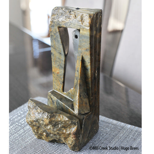Abstract pendulum Brazilian Soapstone Sculpture in greys, copper and green tones.