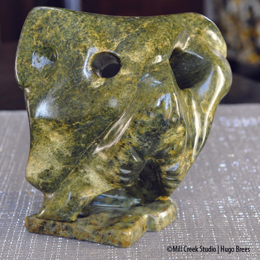 Abstract Canadian grizzly bear in strong yellow and green worked Brazilian Soapstone.