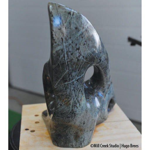 This Brazilian Soapstone sculpture is mesmerizing with its shape and natural cross-hatched stone veining.