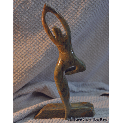 This Brazilian Soapstone sculpture portrays the life of a dancer on the edge.