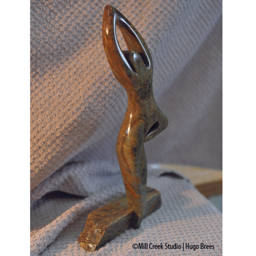 This Brazilian Soapstone sculpture portrays the life of a dancer on the edge.