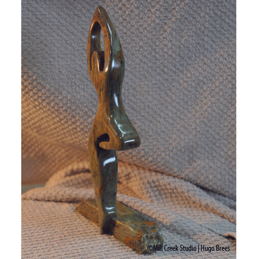 This Brazilian Soapstone sculpture portrays the life of a dancer on the edge.