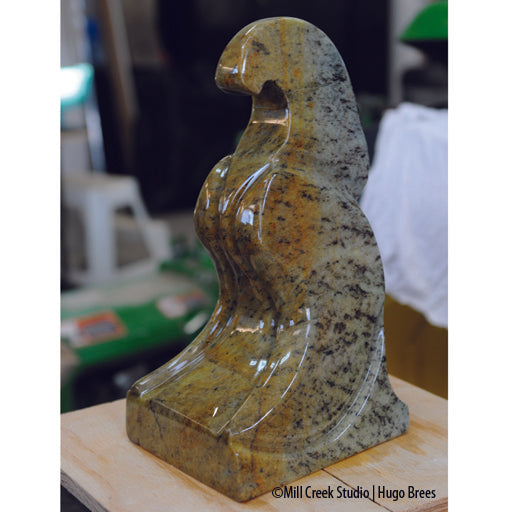 A solid sentinel for the yard/garden, this sculpture is a mix of green, copper, gold and black Brazilian Soapstone.