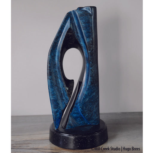 An exquisite, abstract Rankin Inlet Soapstone sculpture with a tinted wax finish.