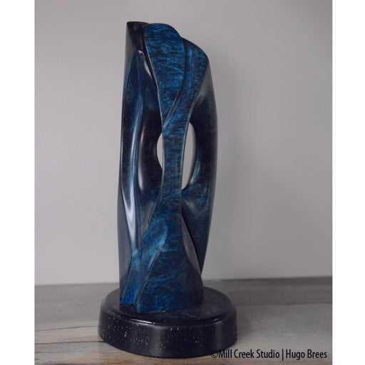 An exquisite, abstract Rankin Inlet Soapstone sculpture with a tinted wax finish.