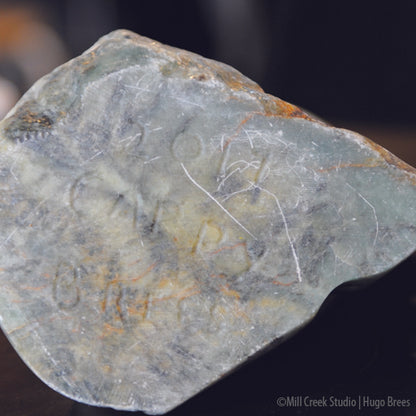 Brazilian Soapstone Sculpture in greens, copper and mottled black stone.