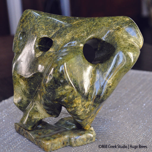 Abstract Canadian grizzly bear in strong yellow and green worked Brazilian Soapstone.