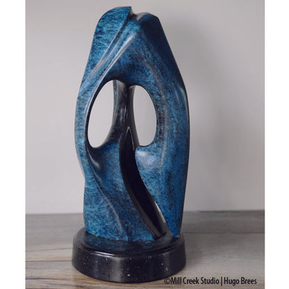 An exquisite, abstract Rankin Inlet Soapstone sculpture with a tinted wax finish.